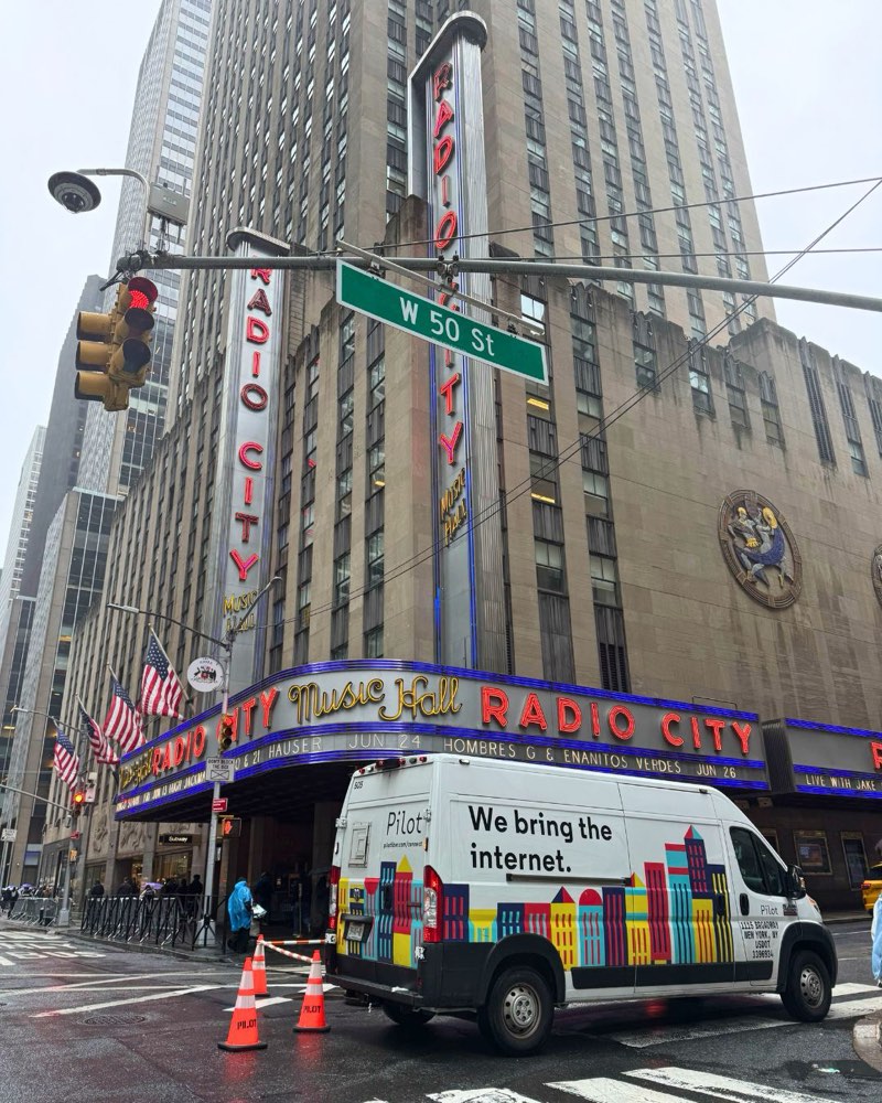 Pilot van and crew cones outside Radio City Music Hall at W 50th Street in New York City